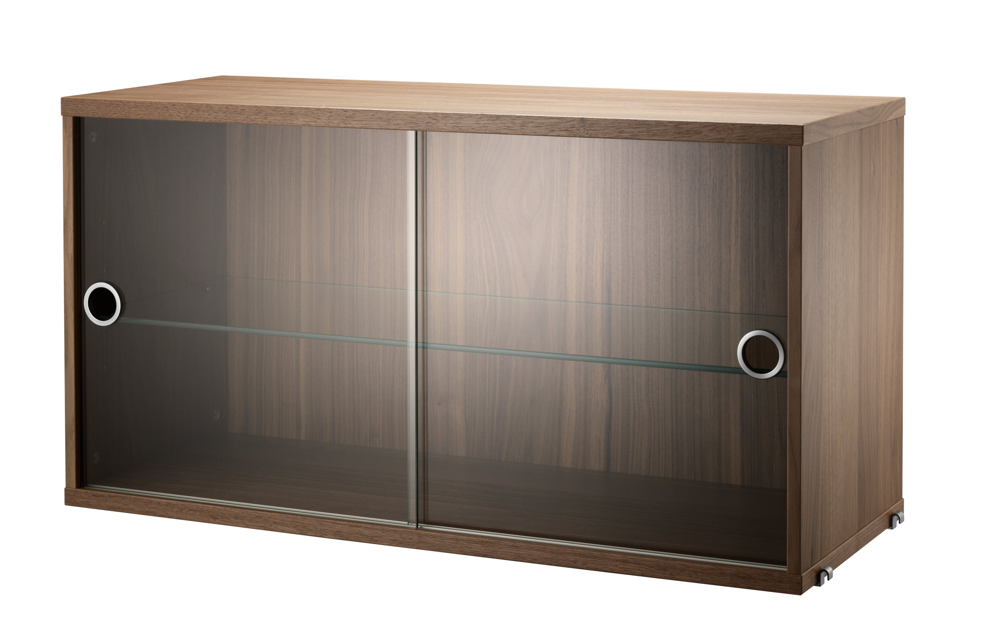 The display cabinet with sliding glass doors is available in one width, 78 cm, and one depth, 30 cm. The display cabinets fit into all wire panels from String® System if the depth of the panels is 30 cm. It is visually pleasing to add a bolder element to your shelf, like a cabinet, which also give you a lot of extra storage and the possibility to showcase something fragile. The display cabinet consists of one adjustable inner shelf in glass and the internal dimensions are: depth 26 cm, width 74 cm, and height 38 cm. The display cabinet is delivered unassembled.
