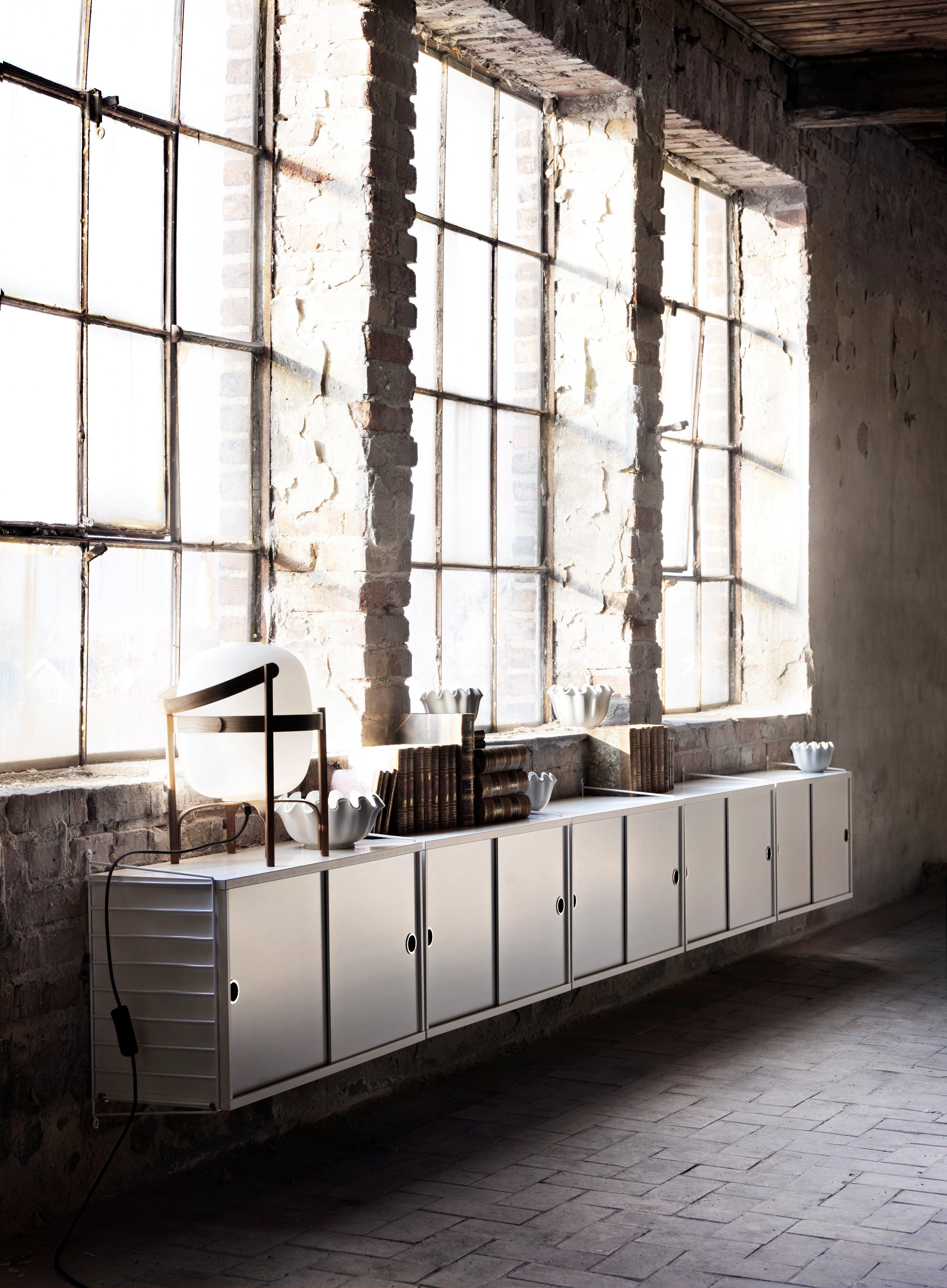 The wall panels are available in two heights, 50 and 75 cm, along with two depths, 20 and 30 cm. The panels are the base when building your string shelf. When the panels are decided you can start adding products from String® System. Choose among different shelves and cabinets. The wall panels are mounted onto a wall and do not touch either the floor or ceiling, which makes the whole shelf easy to adapt to any room. Make your shelf even more functional and unique by adding organizers or hooks, which all are placed on the panel’s threads. The panels come in two different packaging’s, either with one wall panel or two wall panels.