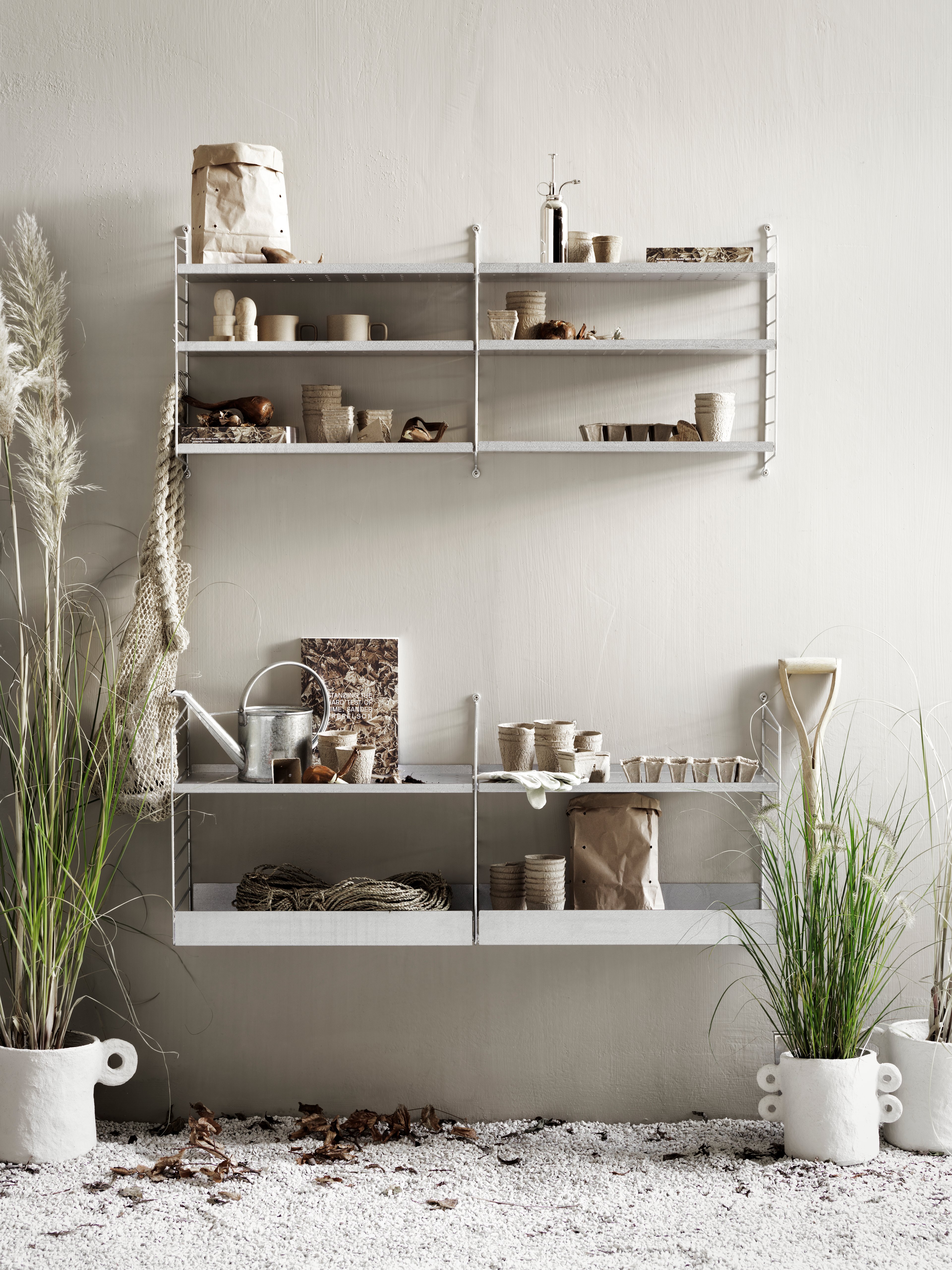 The galvanized wall panels are available in one height, 50 cm along with two depths, 20 and 30 cm. The panels are the base when building your string shelf outdoors. Then, you can start adding galvanized shelves from String® System. Add outdoor-proofed accessories such as j-hooks and s-hooks to cover your storage need. The panels are mounted onto a house façade, wooden fence, or other type of wall where it can stay all year round. The wall panels come in two different packaging’s, either with one wall panel or two wall panels.