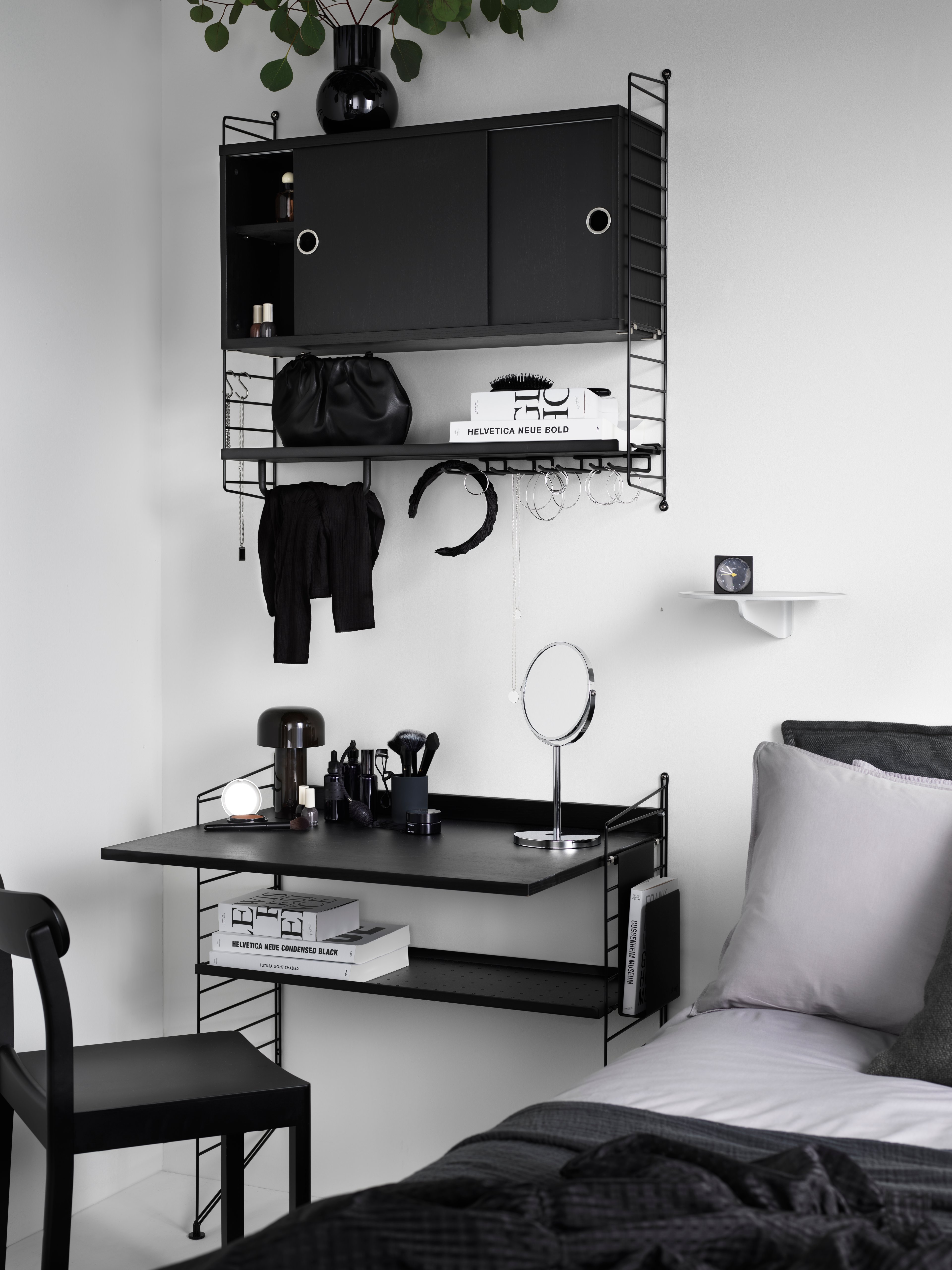 The work desk is available in one size, 78x58 cm and fits into wire panels from String® System with depth 30 cm. The work desk can easily be adjusted to your preferred height and can be used in an office, kitchen, hallway, or any other room where you might have the need for an additional table. Make your workspace complete by mounting a works drawer underneath the work desk where you can store pens, notebooks, and such. Each packaging contains one work desk, one ledge to place against the wall to stabilize the work desk along with brackets. Choose among different colours and wood types.