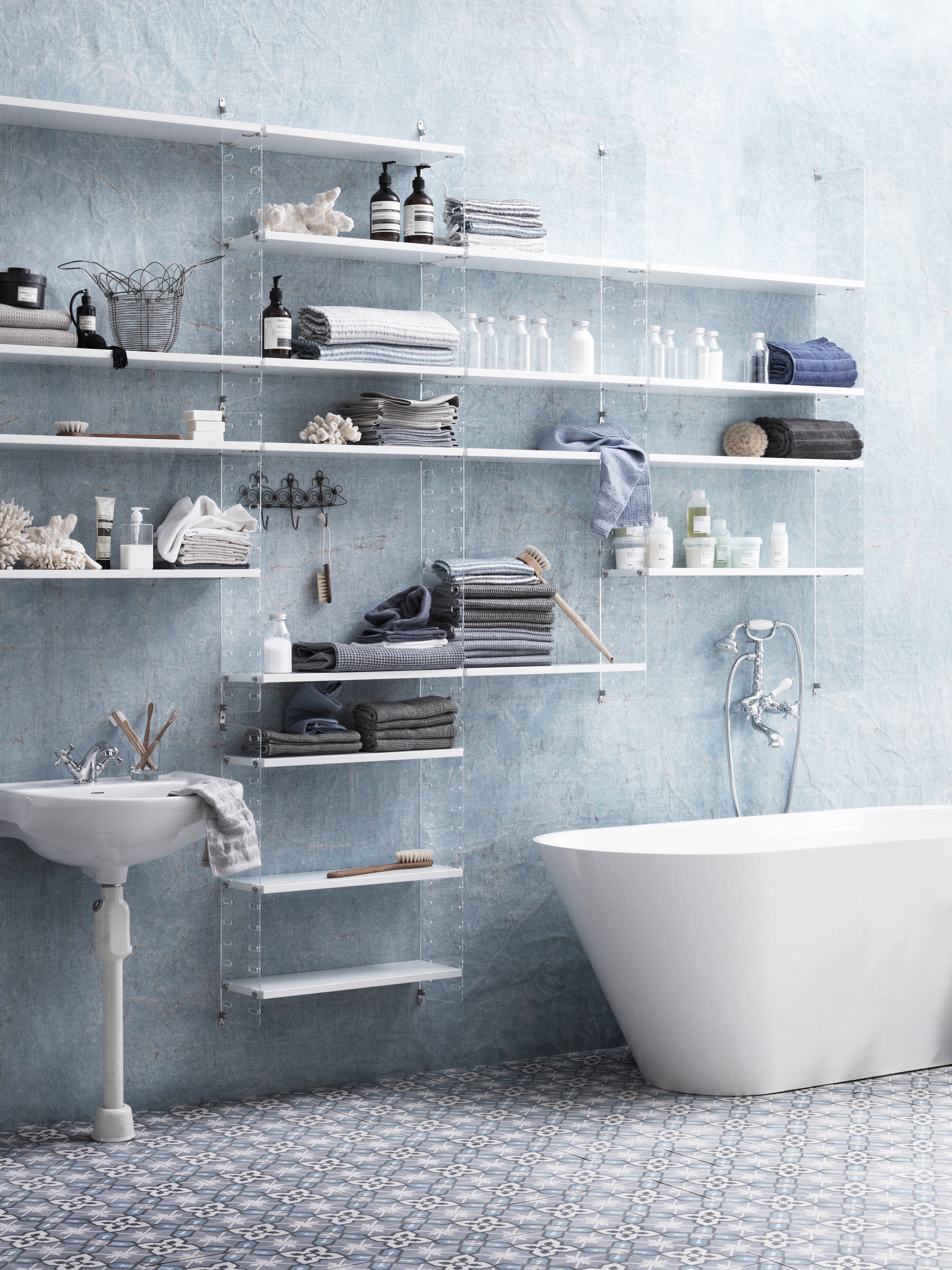 The plex wall panels are available in two heights, 50 and 75 cm, along with two depths, 20 and 30 cm. The panels are the base when building your string shelf. When the panels are decided you can start adding products from String® System. Choose among different shelves, cabinets, and drawers. The wall panels are mounted onto a wall and do not touch either the floor or ceiling. The panels are made of laser cut clear Perspex, which gives the shelf an extra light appearance. The panels come in two different packaging’s, either with one wall panel or two wall panels.