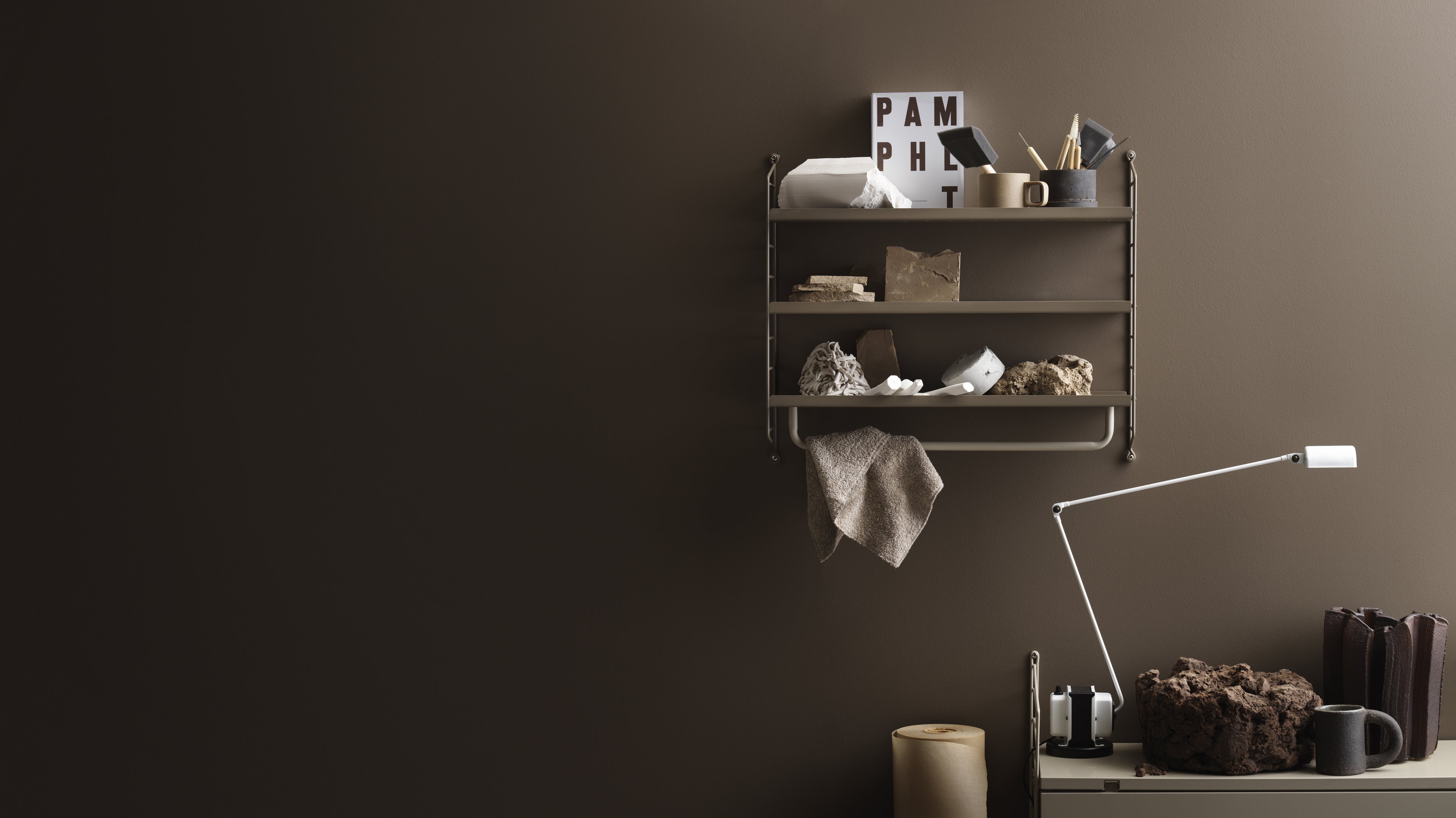 The rods are created to optimize a shelving combination and fit together with metal and galvanized shelves. The rods are available in the following widths: 24 cm, 53 cm, and 72 cm. The rods with widths 53 cm and 72 cm must be mounted along the width of the shelf, whereas the 24 cm wide rod can be mounted along the width or depth, if the shelf has depth 30 cm. The rods increase functionality and makes it possible for even more creative storage solutions. They are the optimal accessory for your hallway or wardrobe shelf since they make is possible to add coat-hangers from String® System. It is also a great spot to hang scarves, shawls or why not the dog leash. Each packaging contains one rod.