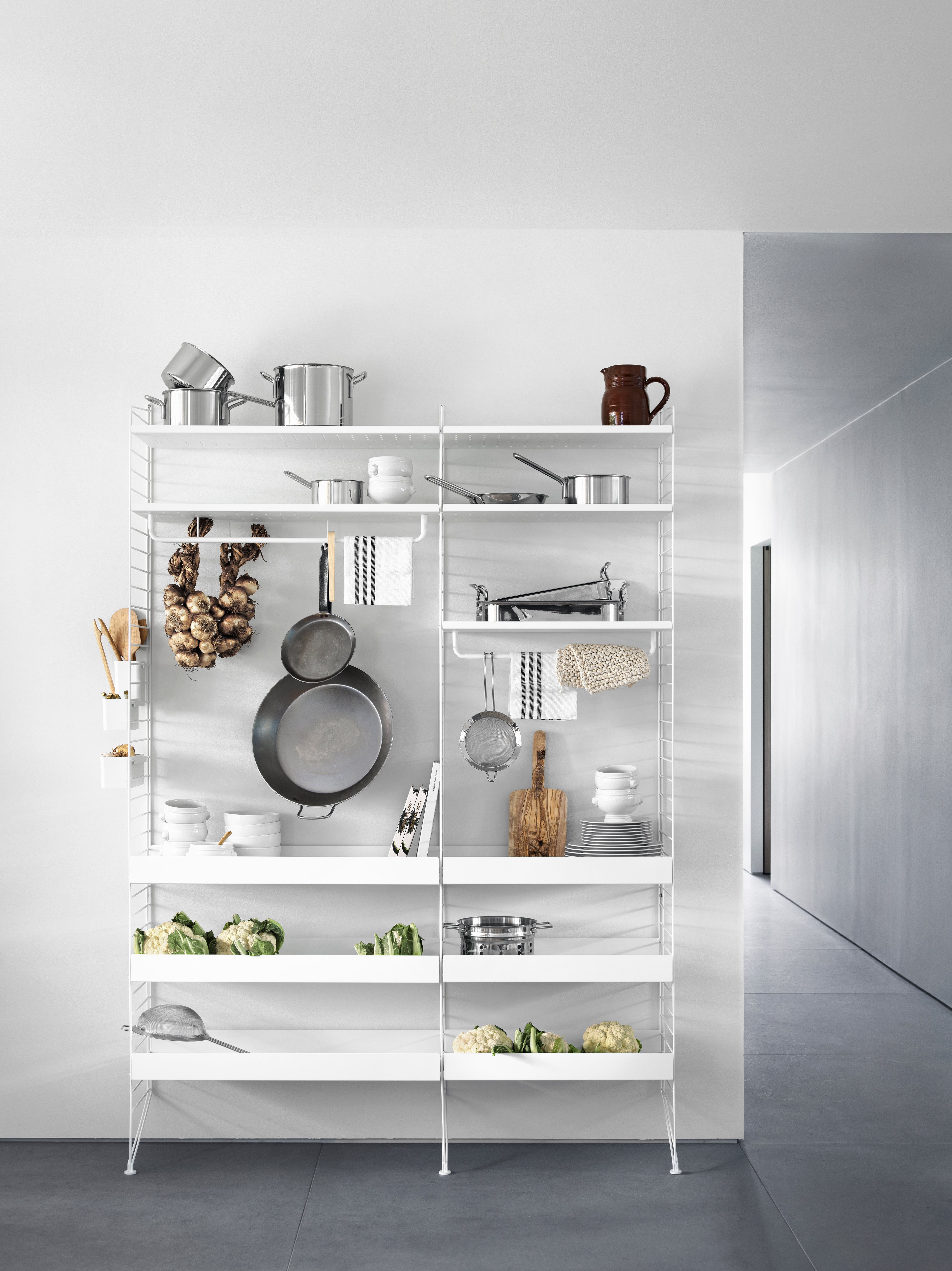 The metal shelves with low edge are available in two widths, 58 and 78 cm, along with two depths, 20 and 30 cm. The shelves are easy to move around and fit into wire and plex panels from String® System if the shelves and panels have the same depth. The 2 cm high edge makes the shelves blend right into a shelving combination with wooden shelves. The perforated shelves are the optimal base to be creative with our accessories. Add hooks, rods, or hanger racks to design your own unique shelf. Each packaging contains one metal shelf.