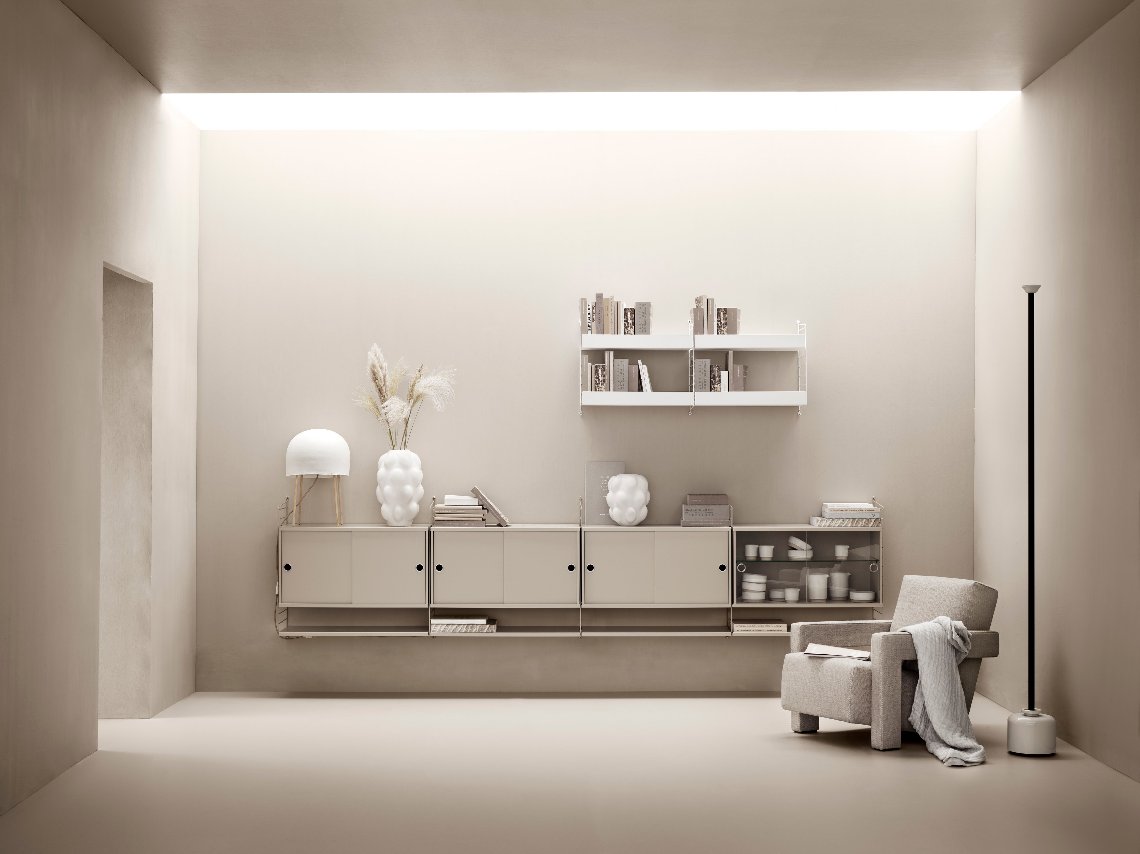 The cabinets with sliding doors are available in one width, 78 cm, along with two depths, 20 and 30 cm. The cabinets fit into all wire and plex panels from String® System. It is visually pleasing to add a bolder element to your shelf, like a cabinet, which also give you a lot of extra storage. The cabinet consists of one divider placed in the middle along with two adjustable inner shelves. The cabinet’s inner dimensions are 4 cm less than the outer dimensions. The cabinets are delivered unassembled.
