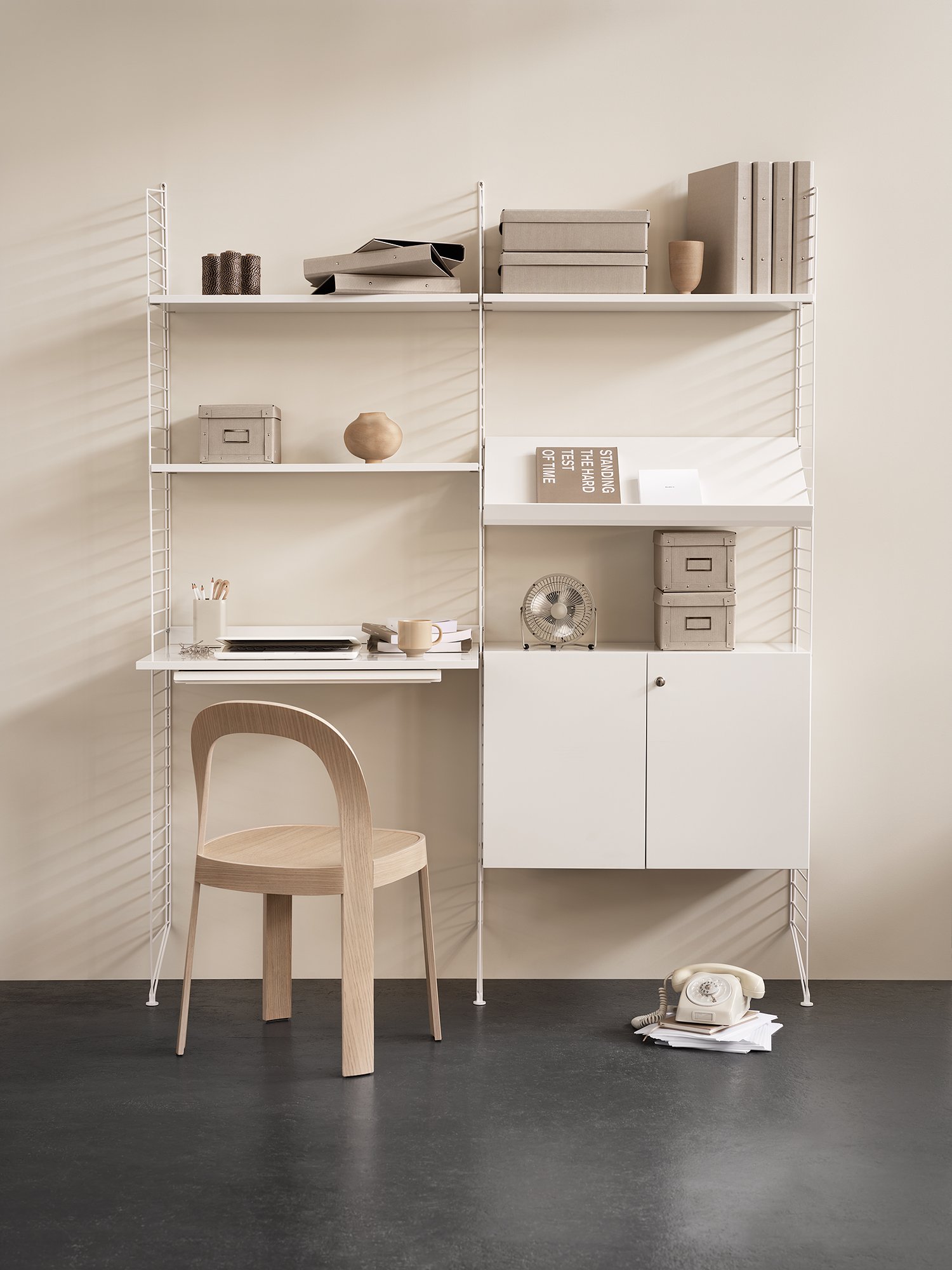 The floor panels are available in three heights, 85 cm, 115 cm, 200 cm along with one depth, 30 cm. The panels are the base when building your string shelf. When the panels are decided you can start adding products with 30 cm depth from String® System. Choose among shelves, cabinets, drawers, magazine shelves and more. The foot of the floor panel rests against the floor which makes the shelf stable while appearing light and airy. Make your shelf even more functional and unique by adding organizers, knife holder or a magazine holder, which all are placed on the panel’s threads. The panels come in two different packaging’s, either with one floor panel or two floor panels.