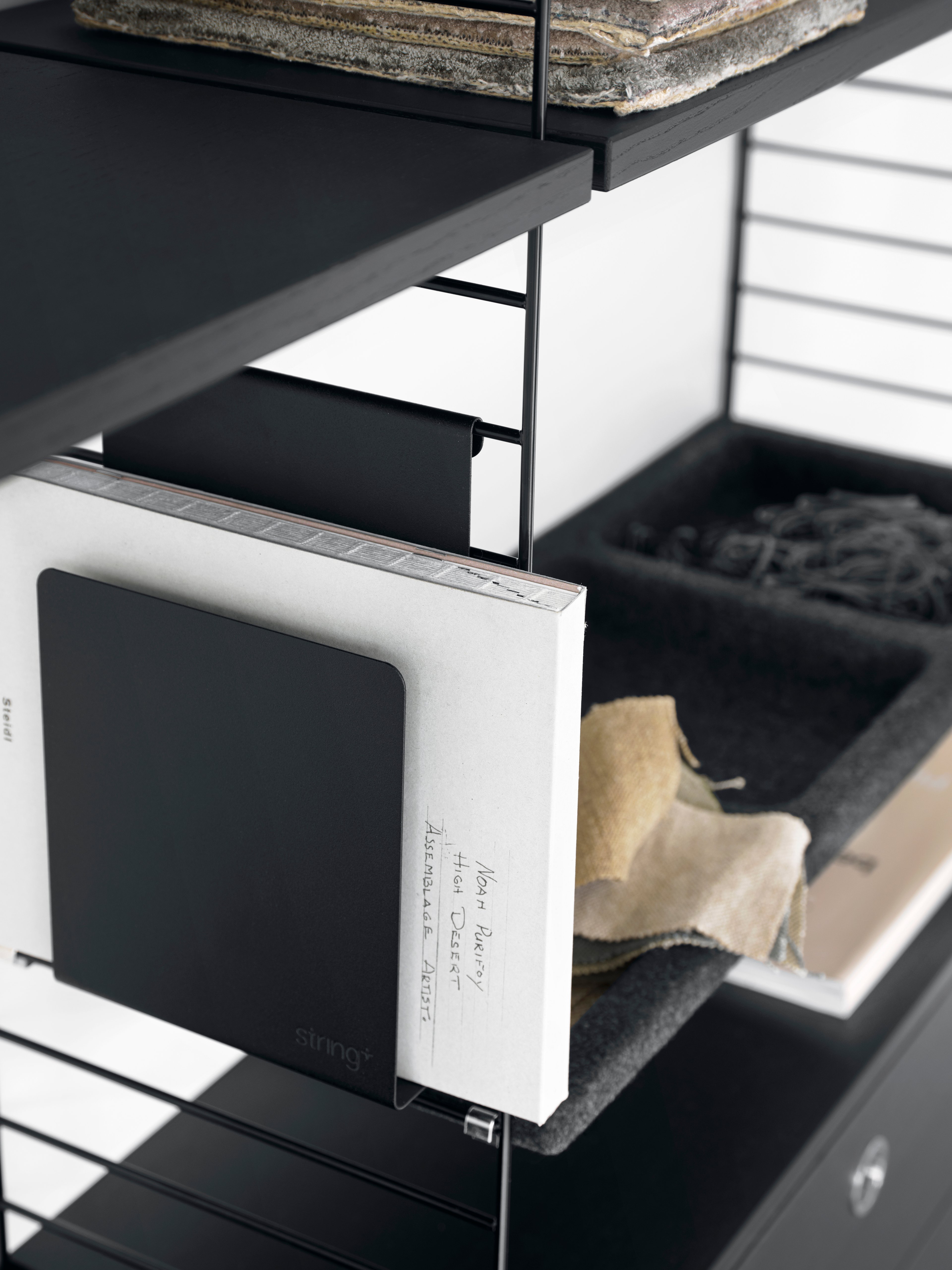 The wall panels are available in two heights, 50 and 75 cm, along with two depths, 20 and 30 cm. The panels are the base when building your string shelf. When the panels are decided you can start adding products from String® System. Choose among different shelves and cabinets. The wall panels are mounted onto a wall and do not touch either the floor or ceiling, which makes the whole shelf easy to adapt to any room. Make your shelf even more functional and unique by adding organizers or hooks, which all are placed on the panel’s threads. The panels come in two different packaging’s, either with one wall panel or two wall panels.