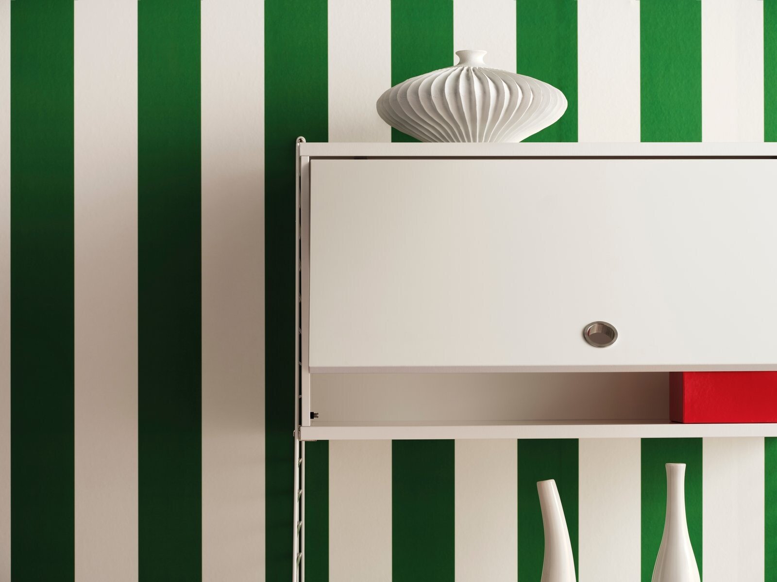 The Cabinet with flip door is available in two widths, 78 cm and 58cm, and one depth, 30 cm. The height of the cabinet is 42 cm. The cabinet fits together with all 30 cm deep wire and plex panels from String® System. The cabinet consists of one adjustable inner shelf. The internal dimensions are w75/w54 x d28.5 x h38 cm. The cabinet is delivered unassembled.