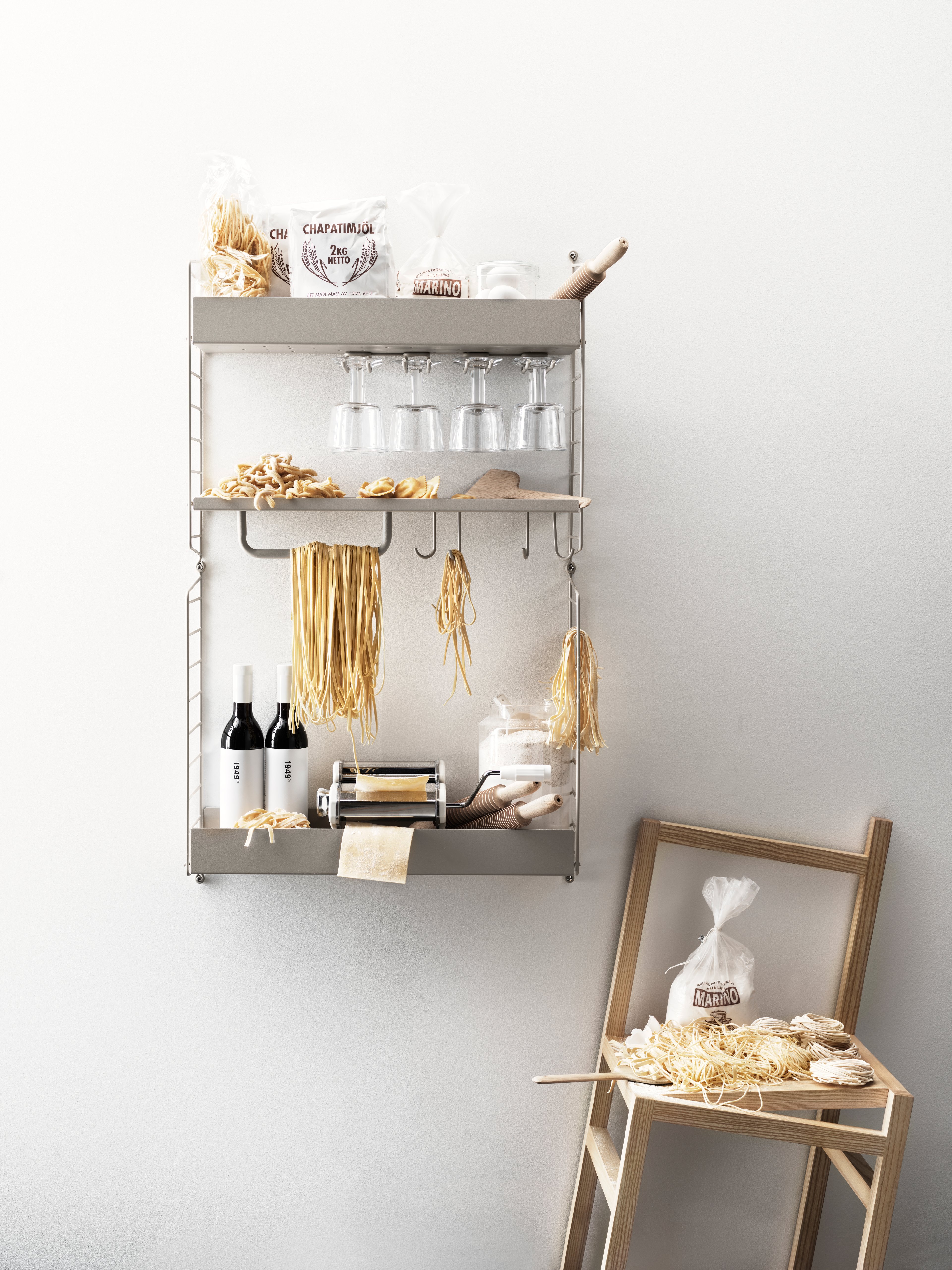The hanger racks are created to optimize a shelving combination with metal or galvanized shelves. It is the optimal kitchen accessory, and it is available in two different sizes, 20 and 30 cm. Number of wine glasses (diameter of the rim: 7 cm) that fit on 20 cm deep hanger racks are 2-3, and 3-4 on 30 cm deep hanger racks. A 58 cm wide metal shelf can fit up to three hanger racks and a 78 cm wide can fit up to four. Each packaging contains two hanger racks, where each hanger rack has two sets of rails.