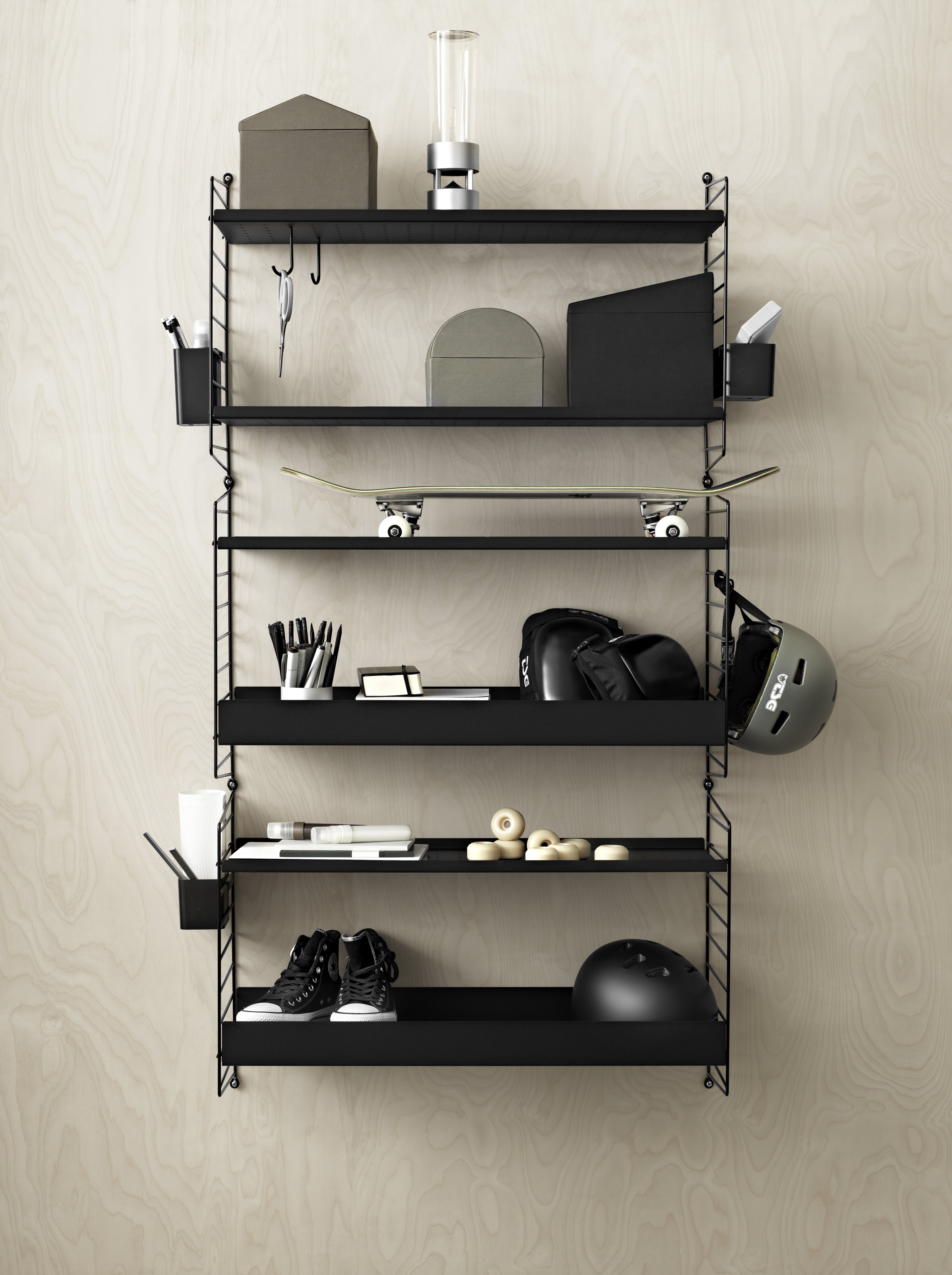 Wall-hung shelf in three sections. A mix of metal shelves with high and low edge adds character to the shelf and order to your kids room. The high edge shelves magically give the impression of tidiness when they hide parts of the mess.