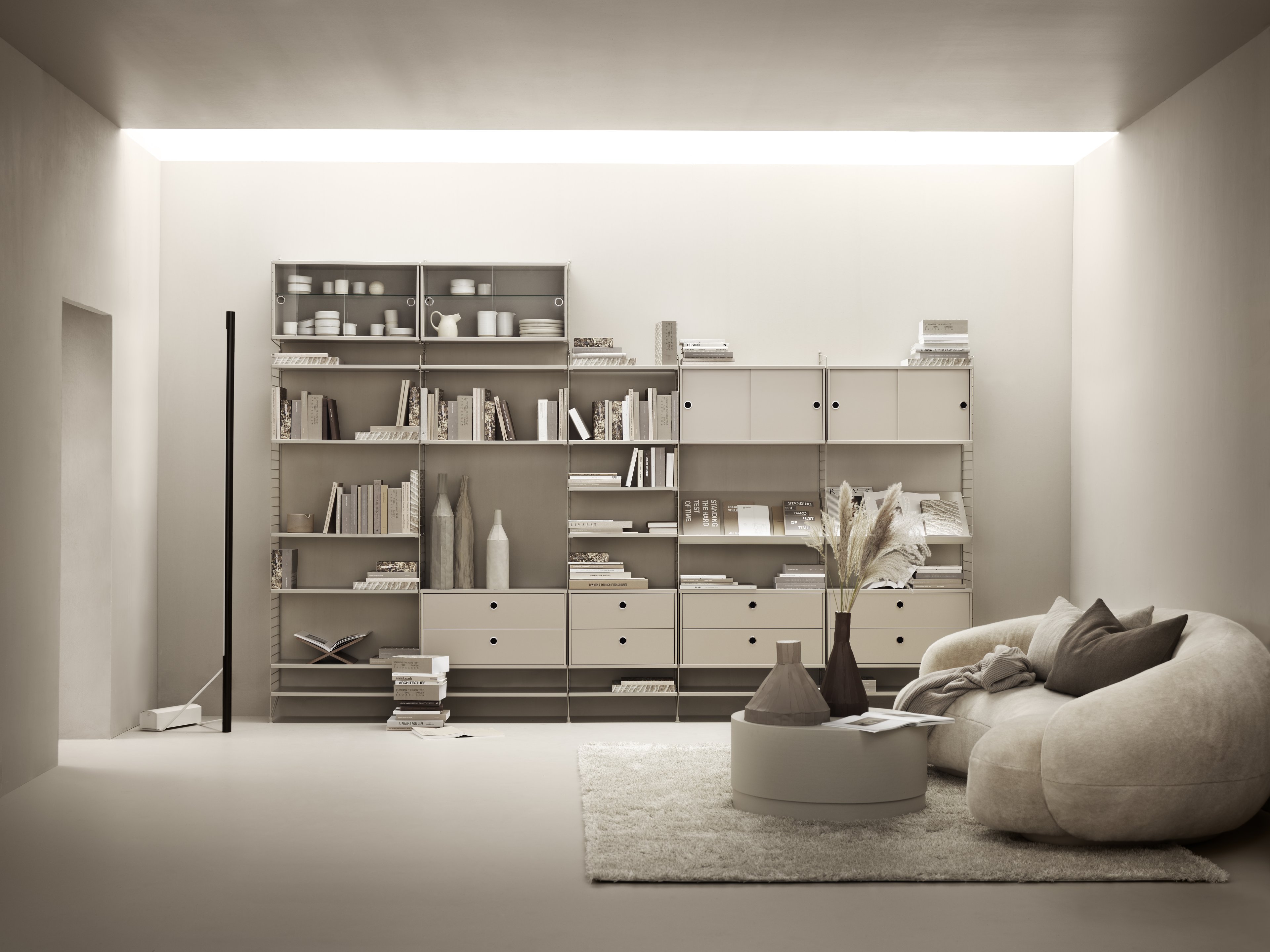 The display cabinet with sliding glass doors is available in one width, 78 cm, and one depth, 30 cm. The display cabinets fit into all wire panels from String® System if the depth of the panels is 30 cm. It is visually pleasing to add a bolder element to your shelf, like a cabinet, which also give you a lot of extra storage and the possibility to showcase something fragile. The display cabinet consists of one adjustable inner shelf in glass and the internal dimensions are: depth 26 cm, width 74 cm, and height 38 cm. The display cabinet is delivered unassembled.