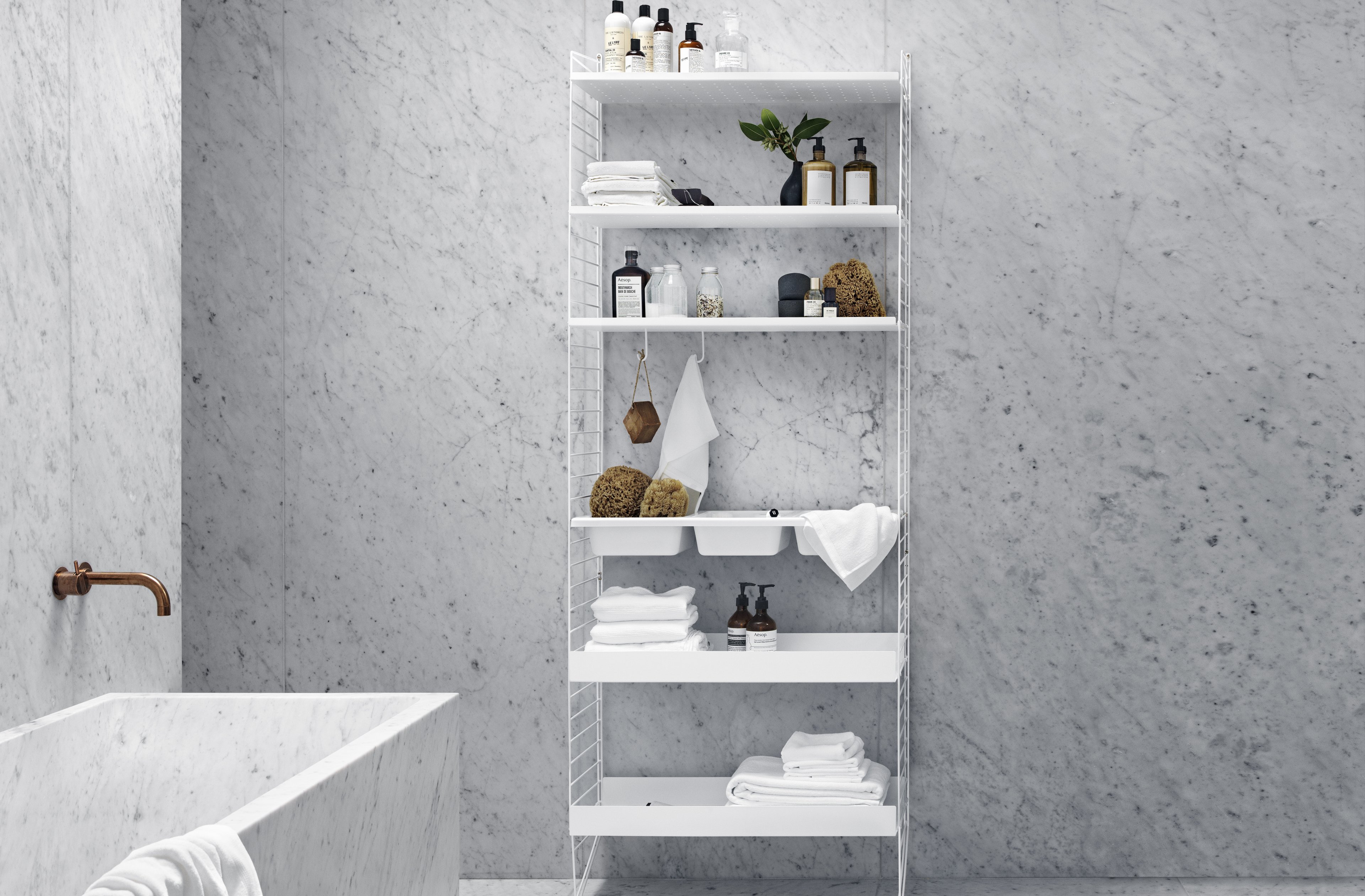 The floor panels are available in three heights, 85 cm, 115 cm, 200 cm along with one depth, 30 cm. The panels are the base when building your string shelf. When the panels are decided you can start adding products with 30 cm depth from String® System. Choose among shelves, cabinets, drawers, magazine shelves and more. The foot of the floor panel rests against the floor which makes the shelf stable while appearing light and airy. Make your shelf even more functional and unique by adding organizers, knife holder or a magazine holder, which all are placed on the panel’s threads. The panels come in two different packaging’s, either with one floor panel or two floor panels.