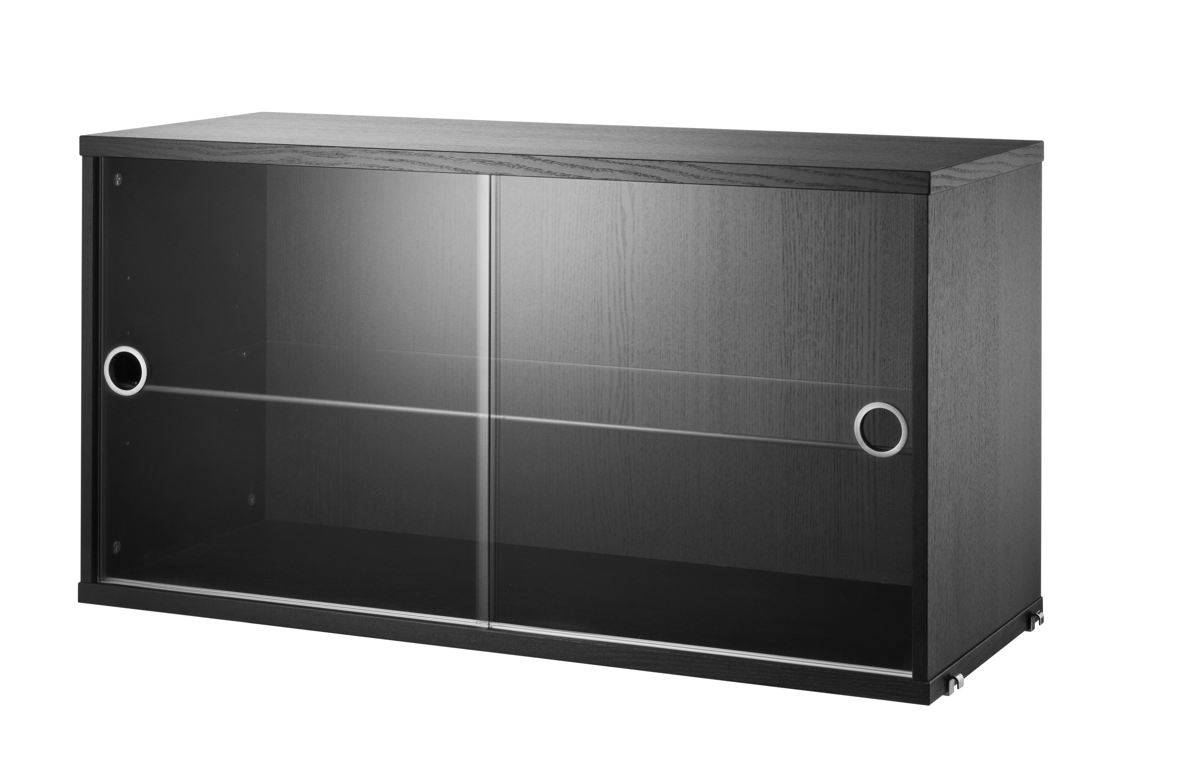 The display cabinet with sliding glass doors is available in one width, 78 cm, and one depth, 30 cm. The display cabinets fit into all wire panels from String® System if the depth of the panels is 30 cm. It is visually pleasing to add a bolder element to your shelf, like a cabinet, which also give you a lot of extra storage and the possibility to showcase something fragile. The display cabinet consists of one adjustable inner shelf in glass and the internal dimensions are: depth 26 cm, width 74 cm, and height 38 cm. The display cabinet is delivered unassembled.