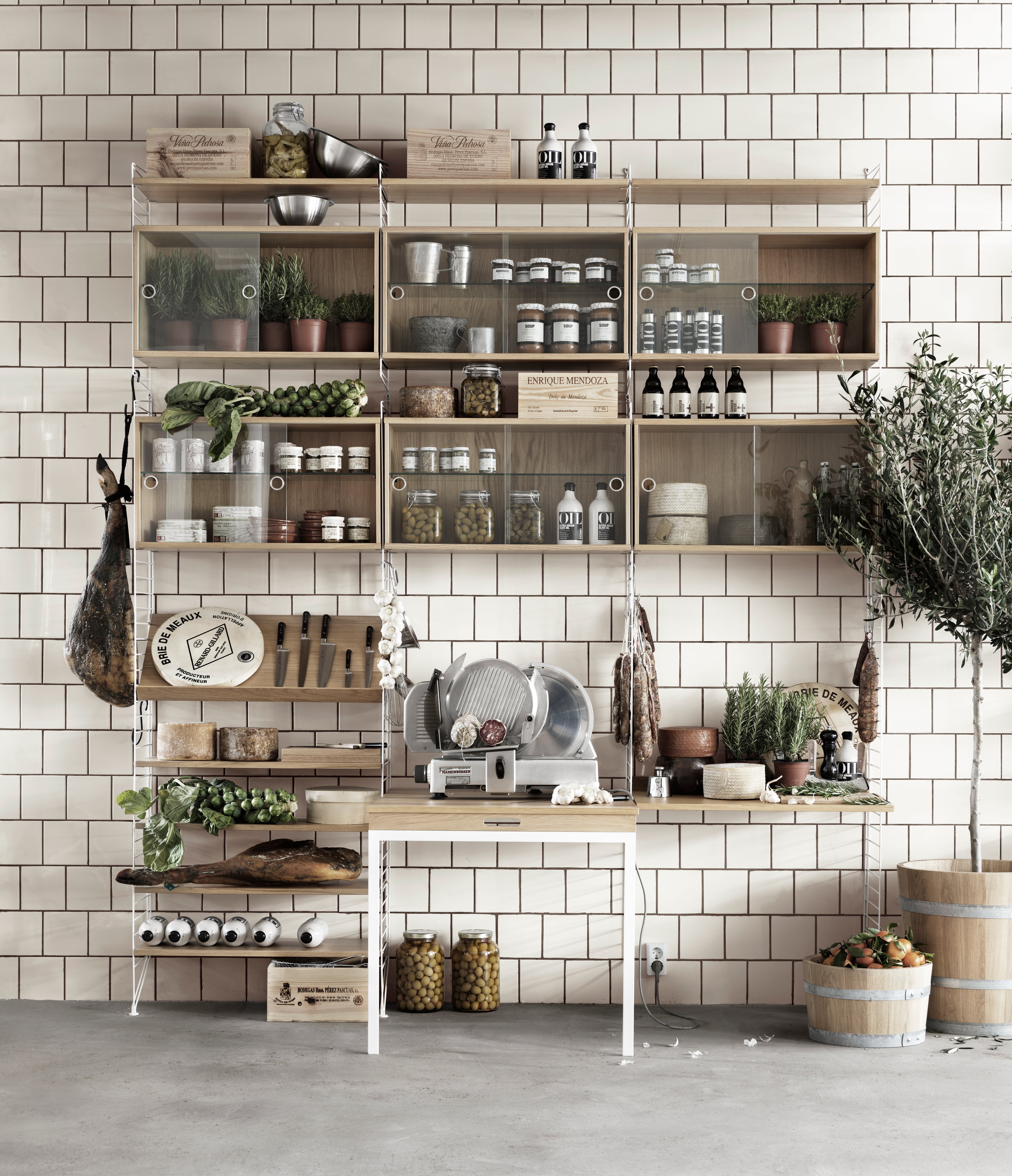 The display cabinet with sliding glass doors is available in one width, 78 cm, and one depth, 30 cm. The display cabinets fit into all wire panels from String® System if the depth of the panels is 30 cm. It is visually pleasing to add a bolder element to your shelf, like a cabinet, which also give you a lot of extra storage and the possibility to showcase something fragile. The display cabinet consists of one adjustable inner shelf in glass and the internal dimensions are: depth 26 cm, width 74 cm, and height 38 cm. The display cabinet is delivered unassembled.