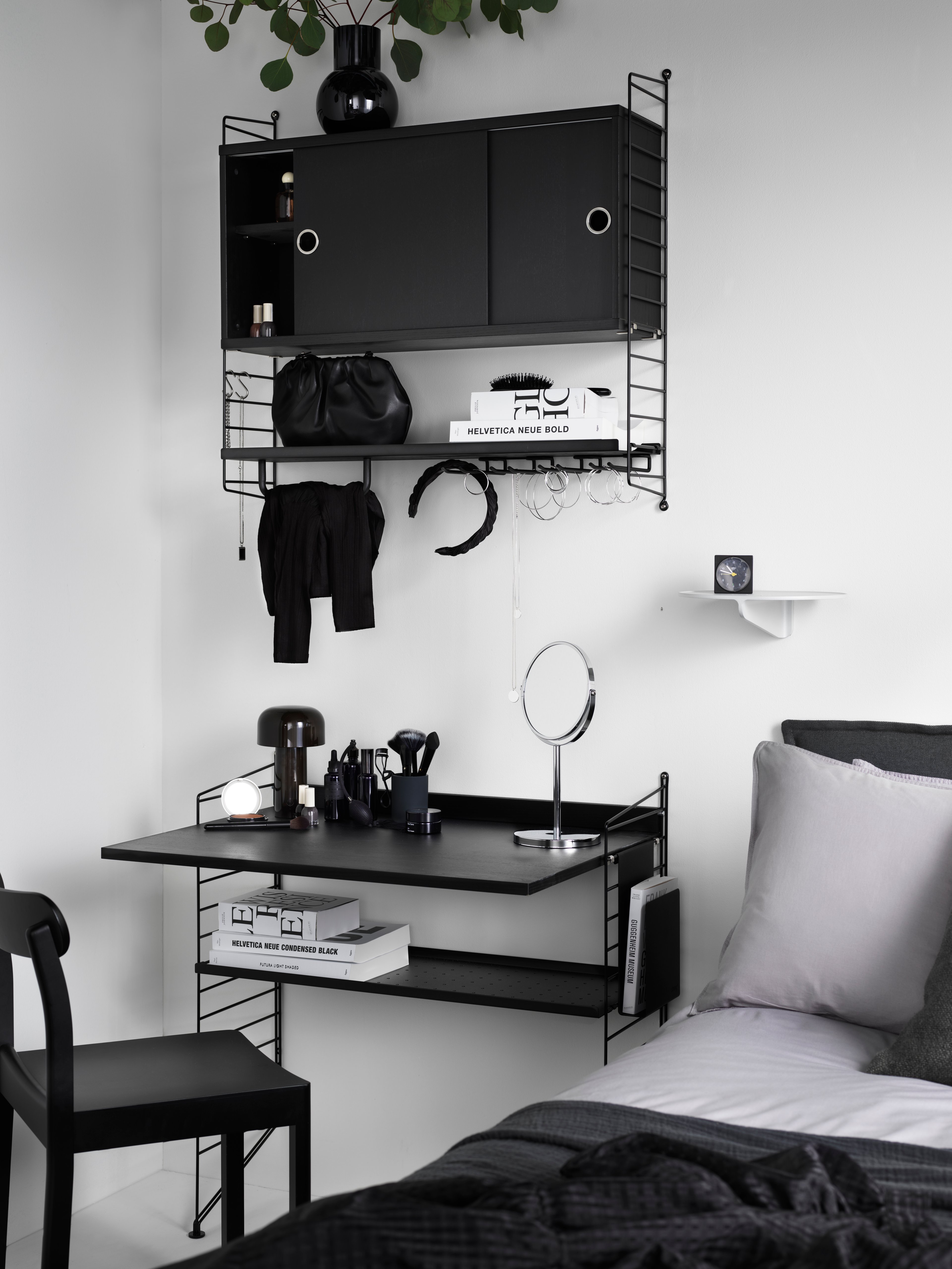 The cabinets with sliding doors are available in one width, 78 cm, along with two depths, 20 and 30 cm. The cabinets fit into all wire and plex panels from String® System. It is visually pleasing to add a bolder element to your shelf, like a cabinet, which also give you a lot of extra storage. The cabinet consists of one divider placed in the middle along with two adjustable inner shelves. The cabinet’s inner dimensions are 4 cm less than the outer dimensions. The cabinets are delivered unassembled.