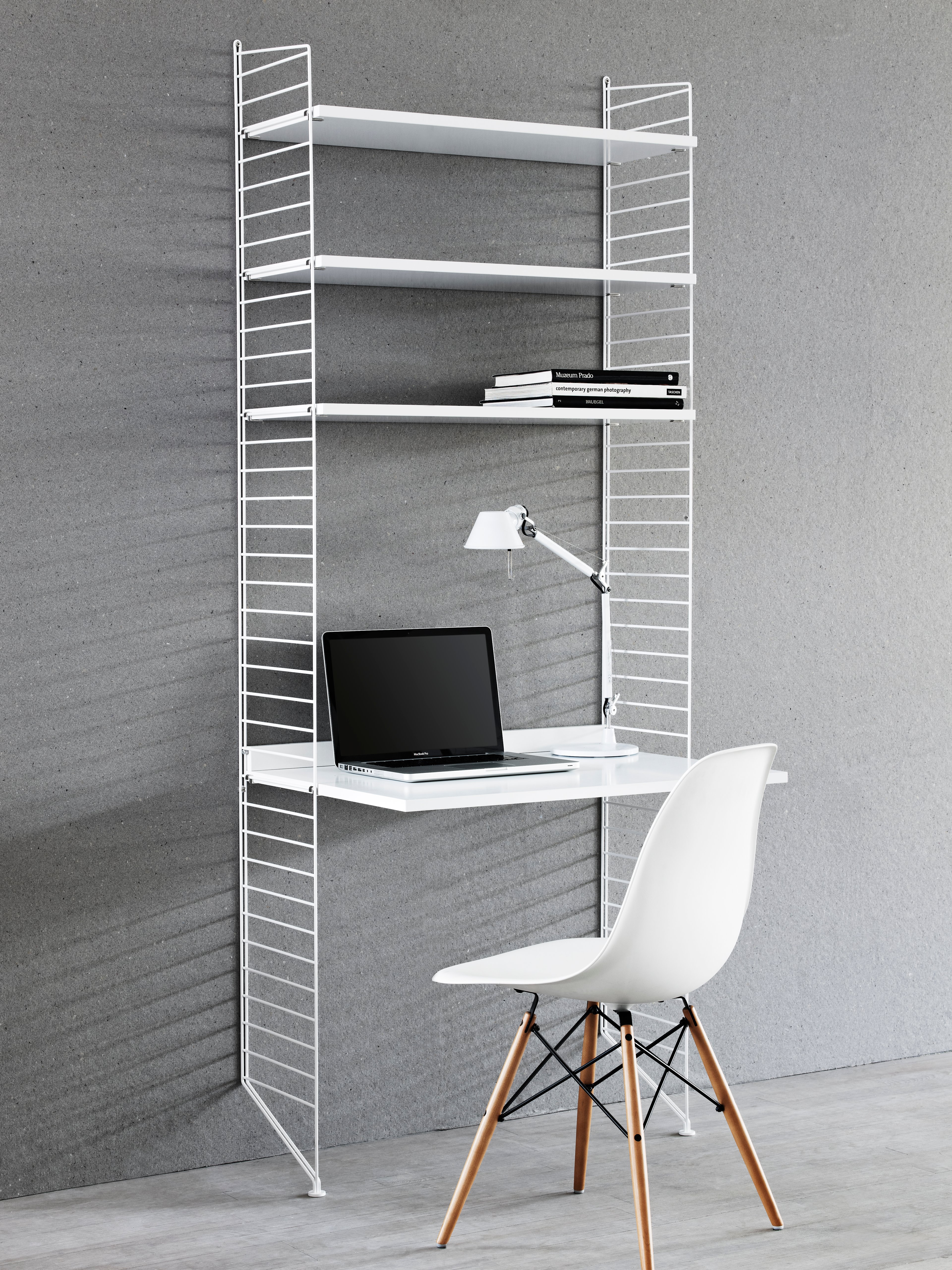 The floor panels are available in three heights, 85 cm, 115 cm, 200 cm along with one depth, 30 cm. The panels are the base when building your string shelf. When the panels are decided you can start adding products with 30 cm depth from String® System. Choose among shelves, cabinets, drawers, magazine shelves and more. The foot of the floor panel rests against the floor which makes the shelf stable while appearing light and airy. Make your shelf even more functional and unique by adding organizers, knife holder or a magazine holder, which all are placed on the panel’s threads. The panels come in two different packaging’s, either with one floor panel or two floor panels.