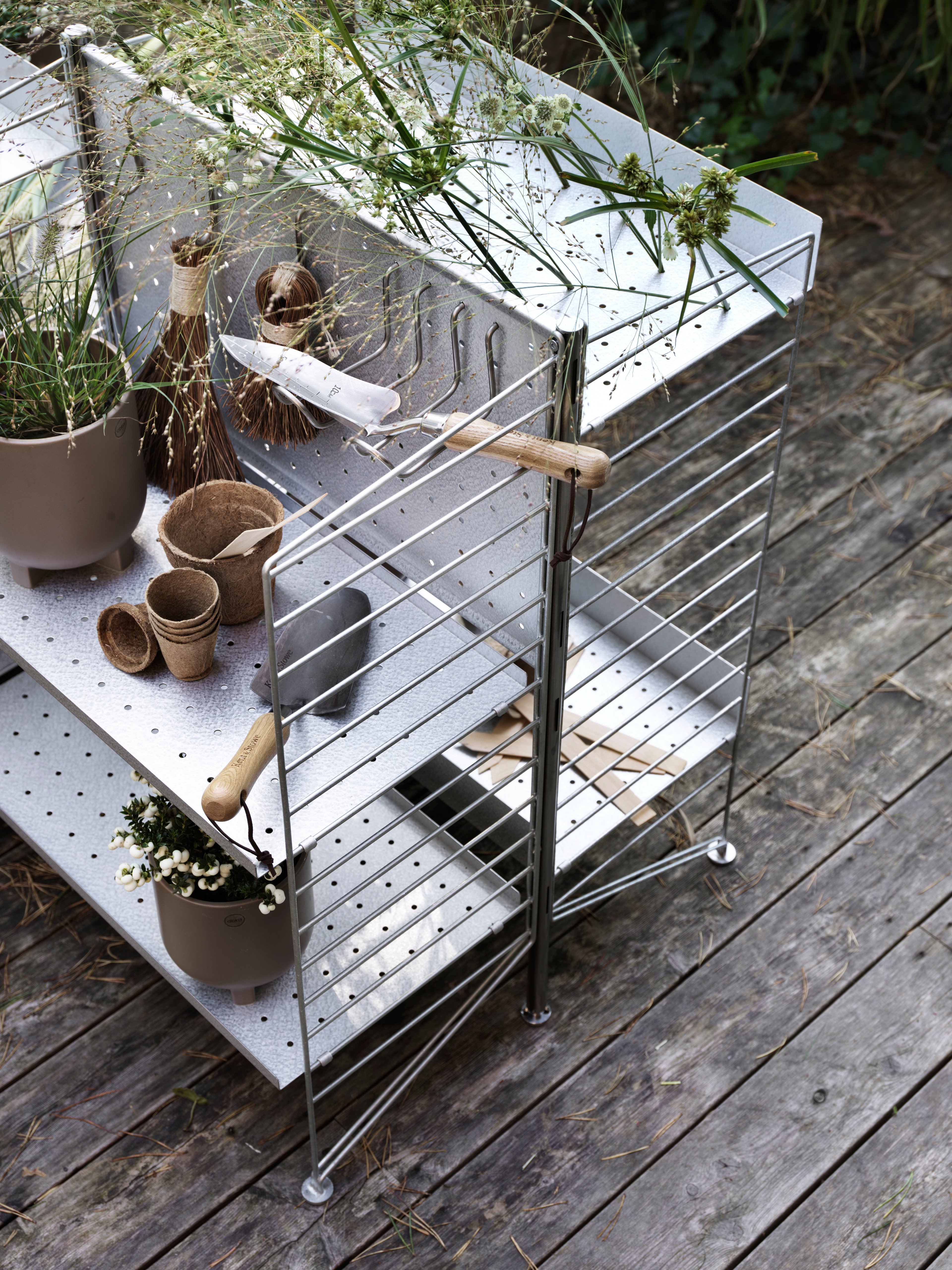 The vertical double hook is designed to fit the back panel to optimize the free standing outdoor shelf. The hook helps you keep track of garden tools, barbecue tools and other items used in relation to outdoor activities. The hook is available in one size with dimensions: width 4 cm, height 10 cm and depth 11.5 cm (when the hook is mounted on the back panel). The hook is made of stainless steel and can withstand all types of weather. Each package contains 2 hooks.