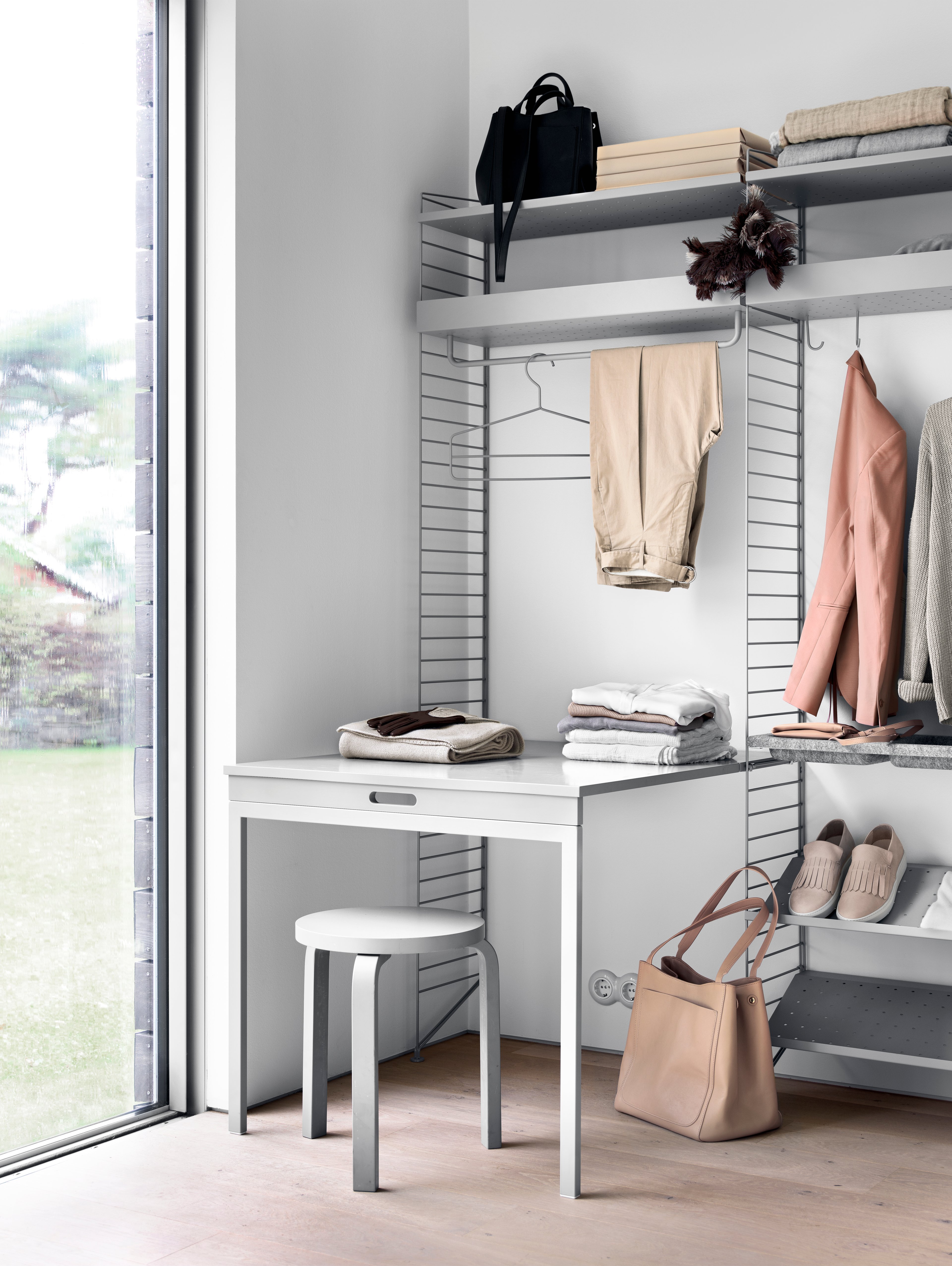 The rods are created to optimize a shelving combination and fit together with metal and galvanized shelves. The rods are available in the following widths: 24 cm, 53 cm, and 72 cm. The rods with widths 53 cm and 72 cm must be mounted along the width of the shelf, whereas the 24 cm wide rod can be mounted along the width or depth, if the shelf has depth 30 cm. The rods increase functionality and makes it possible for even more creative storage solutions. They are the optimal accessory for your hallway or wardrobe shelf since they make is possible to add coat-hangers from String® System. It is also a great spot to hang scarves, shawls or why not the dog leash. Each packaging contains one rod.
