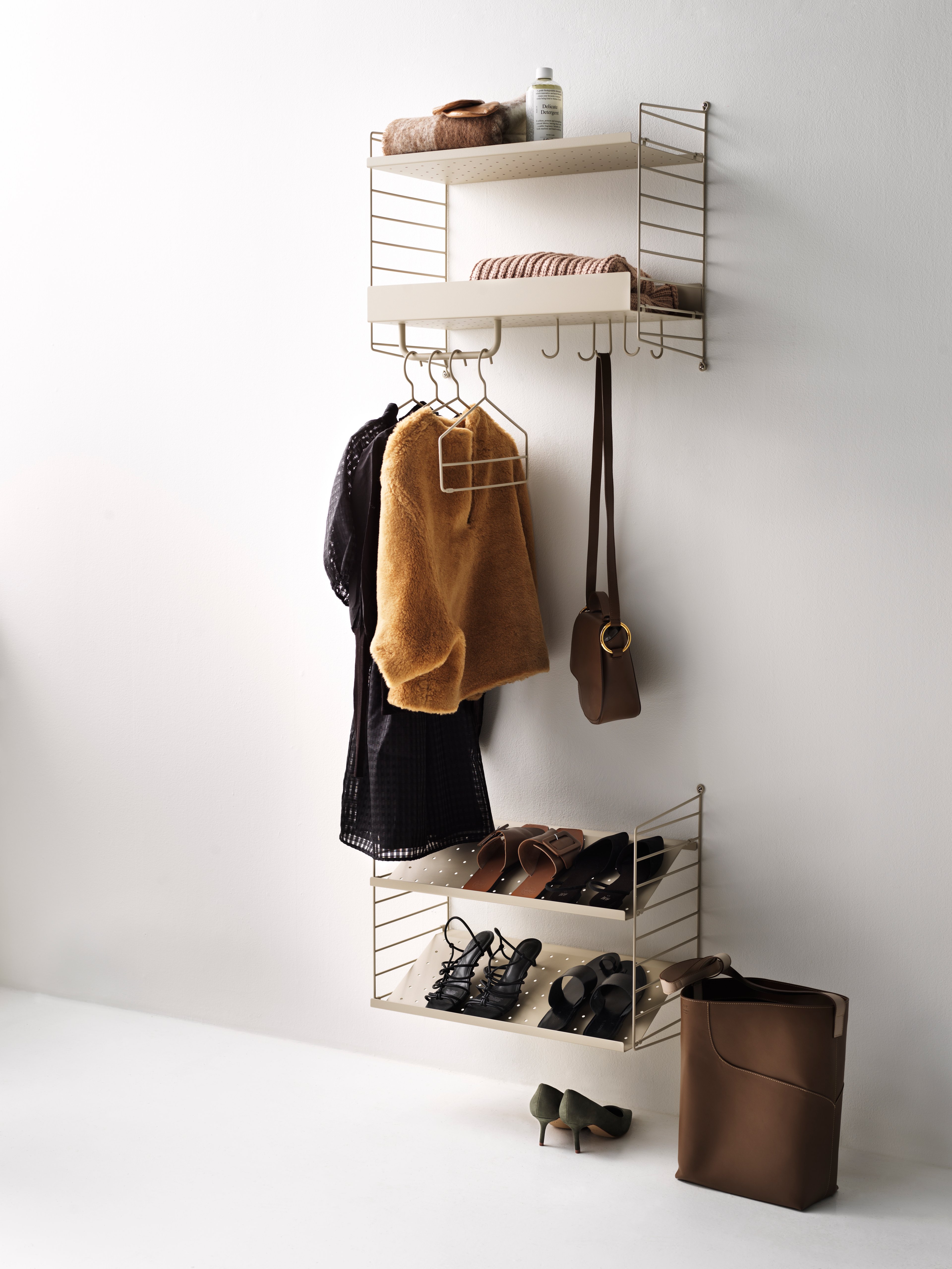 The coat-hanger is part of our range of accessories and was created to be able to offer a complete storage solution for your hallway and wardrobe, where rods often are added. The coat-hanger is designed with one extra wire thread to increase functionality and make it possible to hang several clothing items on one coat-hanger. Each packaging contains four coat-hangers.