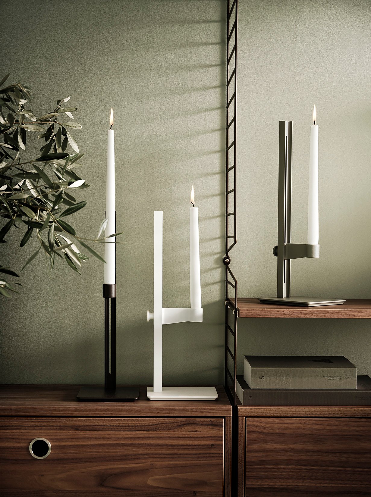 The Museum candle holder is an adjustable candle holder in aluminium. The candle holder has the following dimensions: w13 x d15 x h40 cm where the highest height for the candle is 35.5 cm, and the lowest height is 3.5 cm.