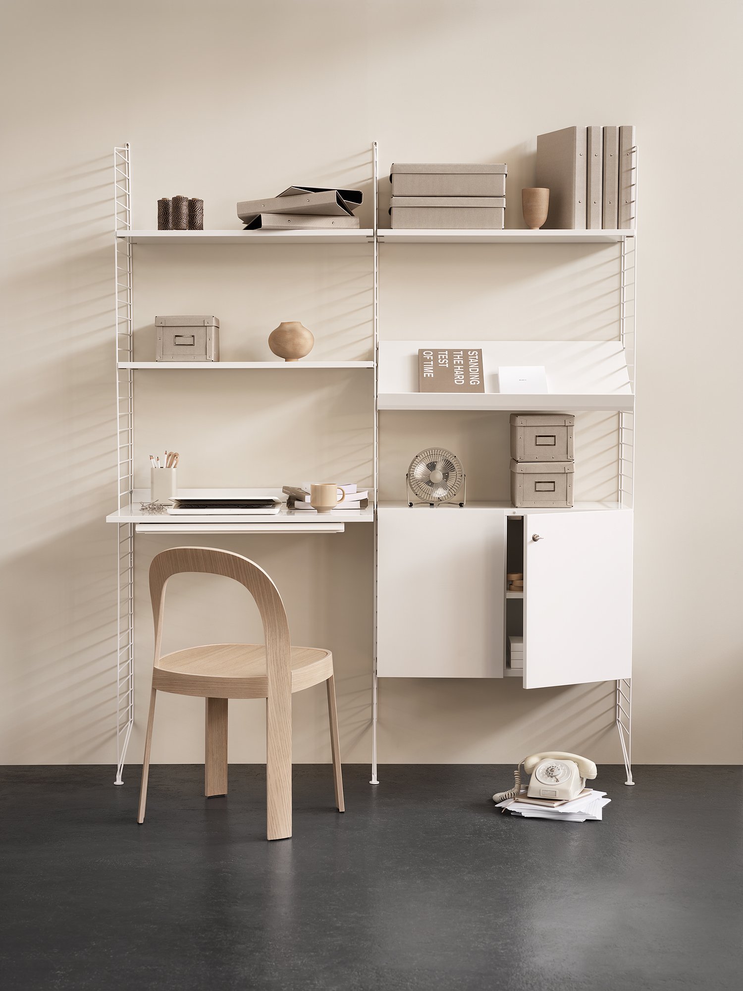Cabinet with lock is available in one width, 78 cm, one depth, 32 cm, and one height, 52 cm. Combine it with floor panels from the String® System to create an optimal solution for your workspace, where you can store all your binders, cables, papers, and similar items. The doors are equipped with push-open fittings, and the right-hand door is lockable (two keys included). The inner dimensions of the cabinet are: w74 x d29 x h47 cm, and it has two inner shelves that can be adjusted to any height.