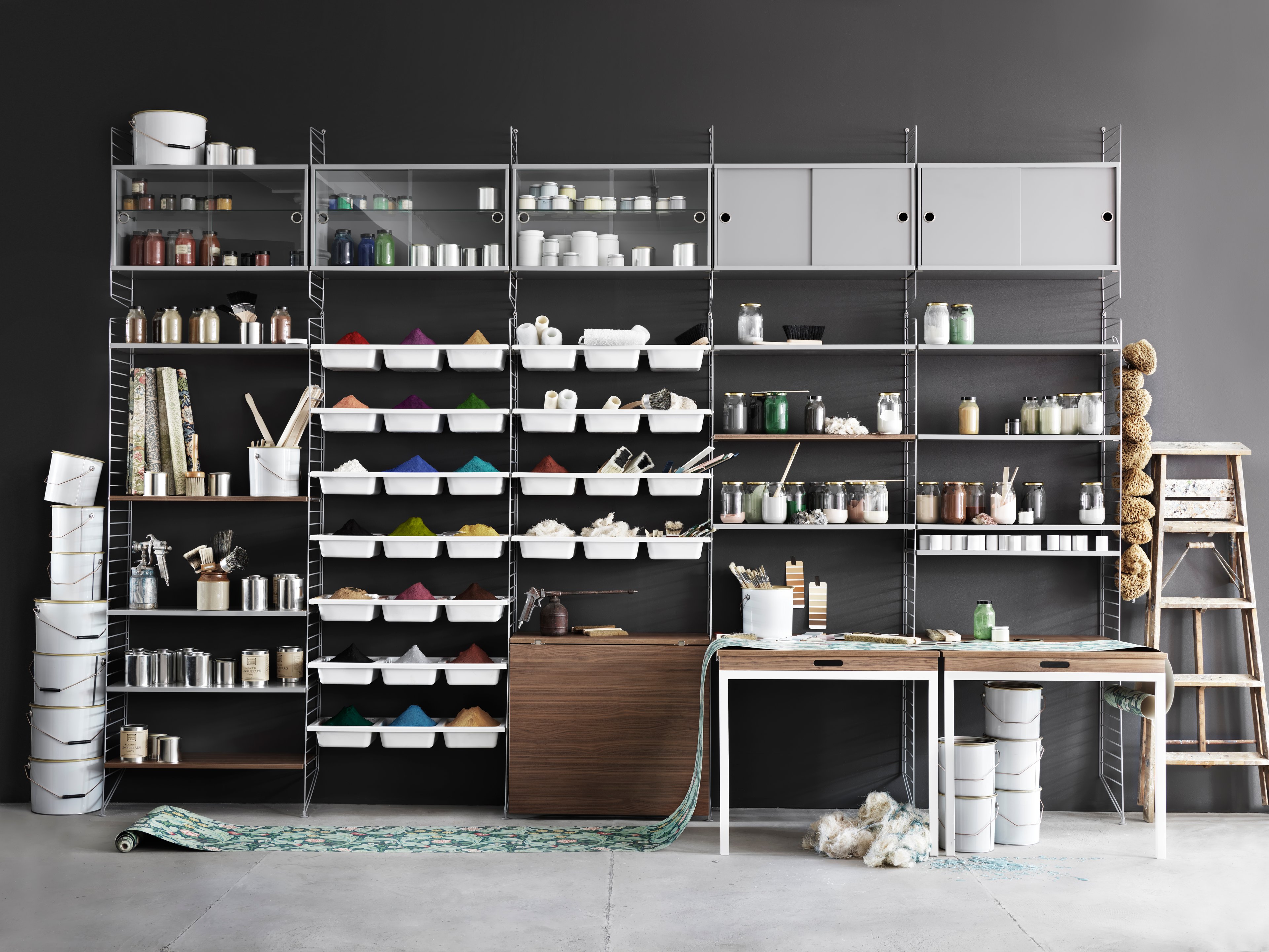The display cabinet with sliding glass doors is available in one width, 78 cm, and one depth, 30 cm. The display cabinets fit into all wire panels from String® System if the depth of the panels is 30 cm. It is visually pleasing to add a bolder element to your shelf, like a cabinet, which also give you a lot of extra storage and the possibility to showcase something fragile. The display cabinet consists of one adjustable inner shelf in glass and the internal dimensions are: depth 26 cm, width 74 cm, and height 38 cm. The display cabinet is delivered unassembled.